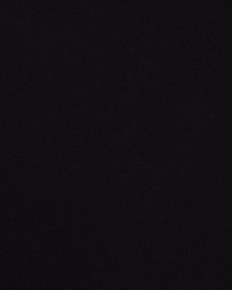 Close up of the custom oxford polo shirt for men by Luxire in black pique