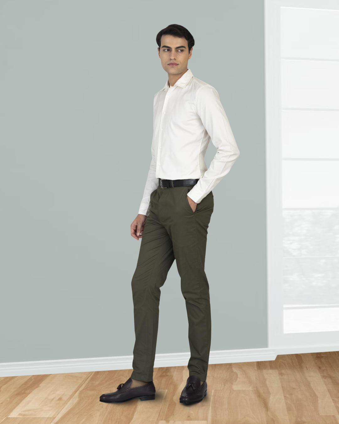 Model wearing custom Genoa Chino pants for men by Luxire in olive green hand in pocket