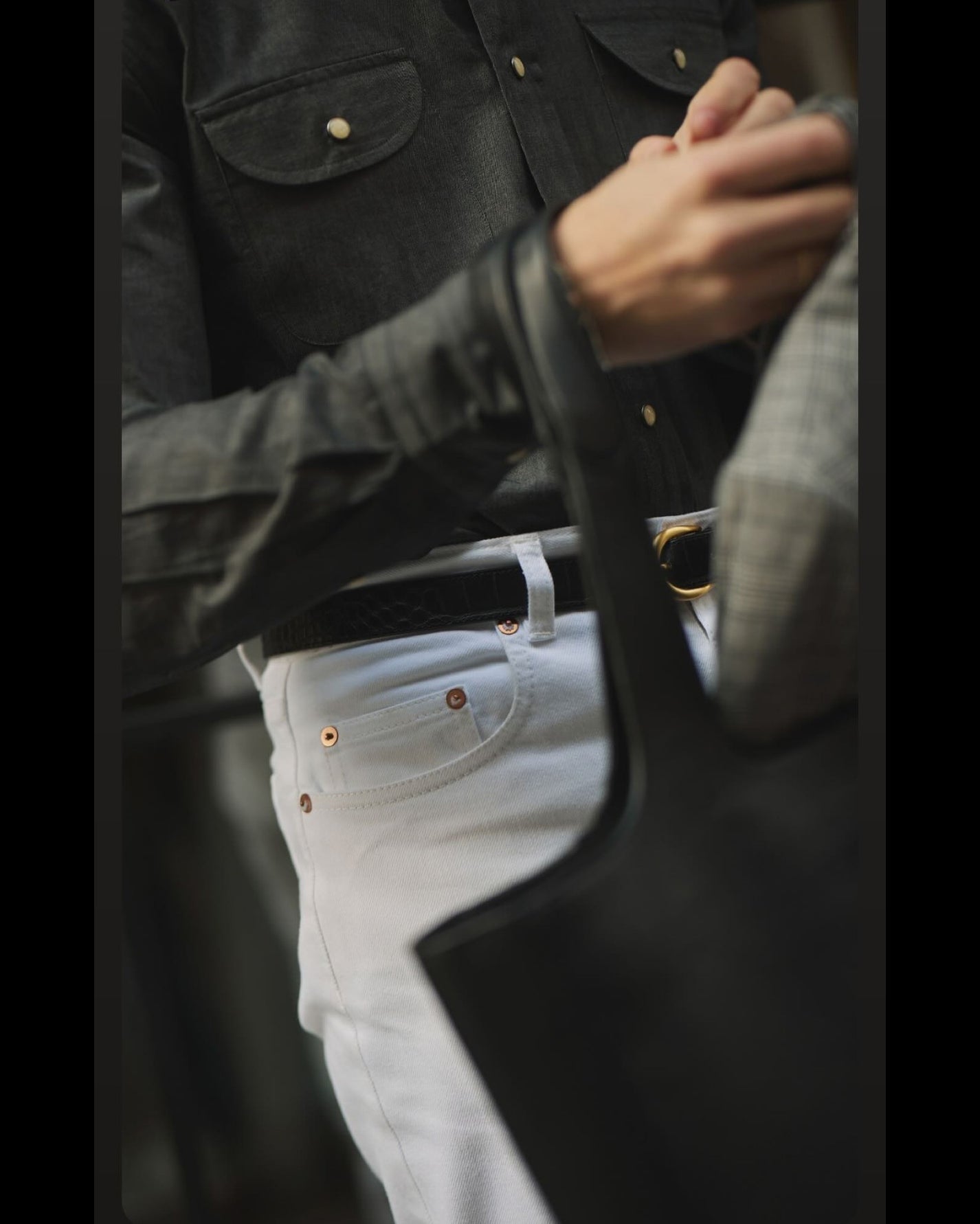 Close up of model outside wearing mens heavy twill jeans by Luxire in white 4