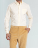 Model wearing the custom oxford shirt for men by Luxire in pale yellow hand in pocket 3