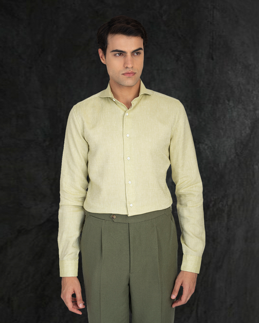 Model wearing the custom linen shirt for men in light olive green by Luxire Clothing